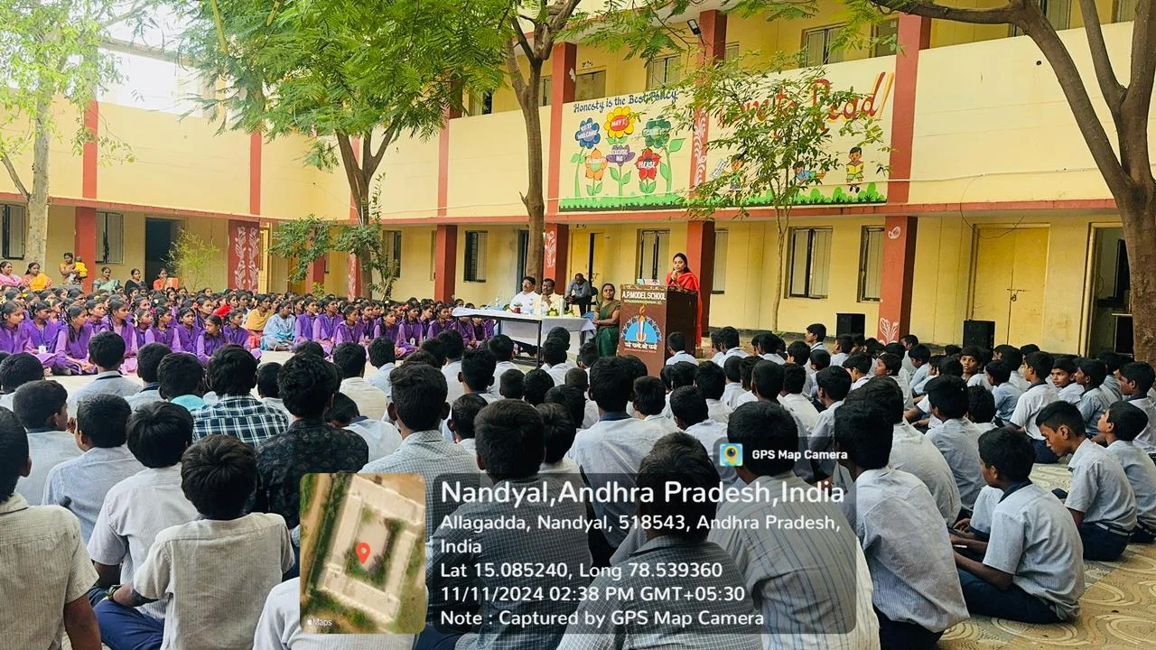 Dr. Omkaram Sindhuja speaking at AP Model School assembly on student stress and emotional care